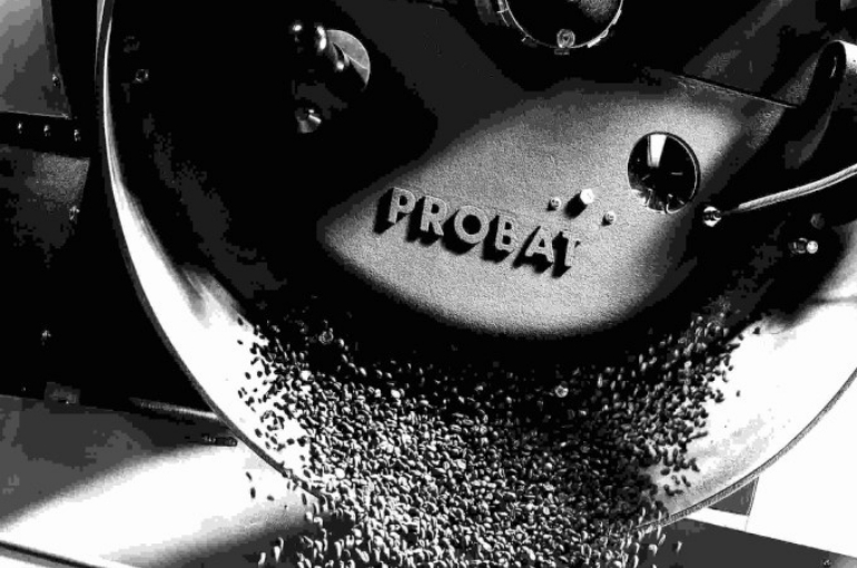 Probat coffee roasting and grinding machinery in black and white