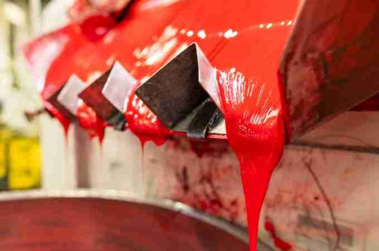 Jänecke+Schneemann's Liquid Technologies with red ink dripping from a machine